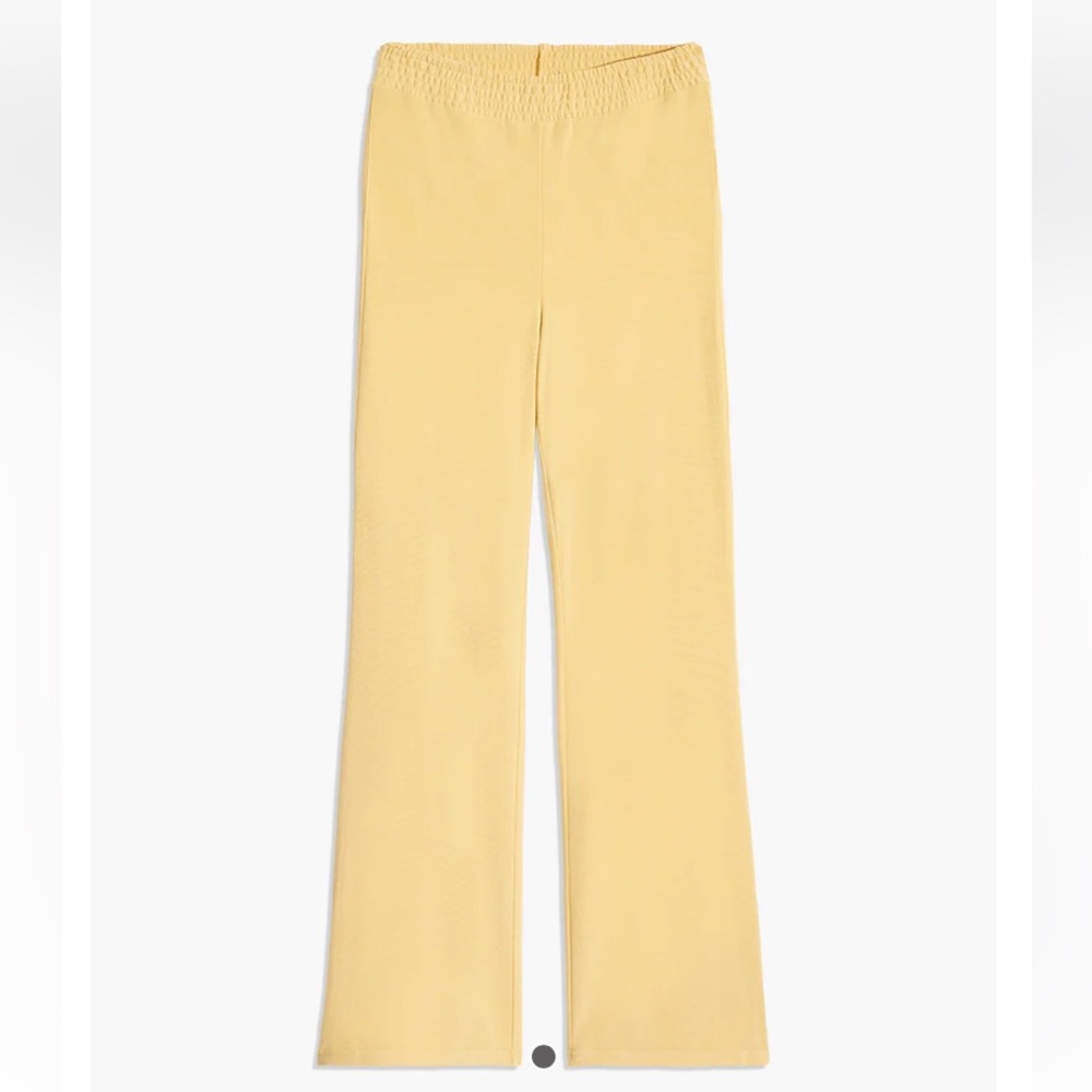 WEWOREWHAT Smocked Flare Pants in yellow